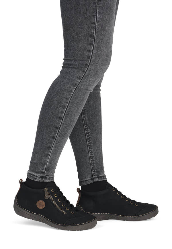 Rieker 52514-00 women's black zip & lace shoe boots, on-foot lifestyle view.