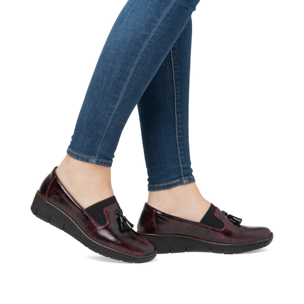 Rieker 53751-35 Burgundy Patent Slip on Shoe, on-foot lifestyle view.