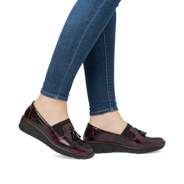 Rieker 53751-35 Burgundy Patent Slip on Shoe, on-foot lifestyle view.