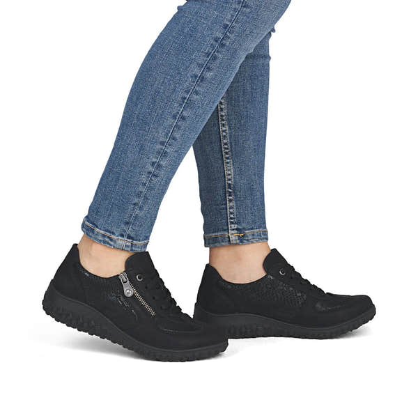 Rieker 59501-00 women's black zip & lace trainers, on-foot lifestyle view.