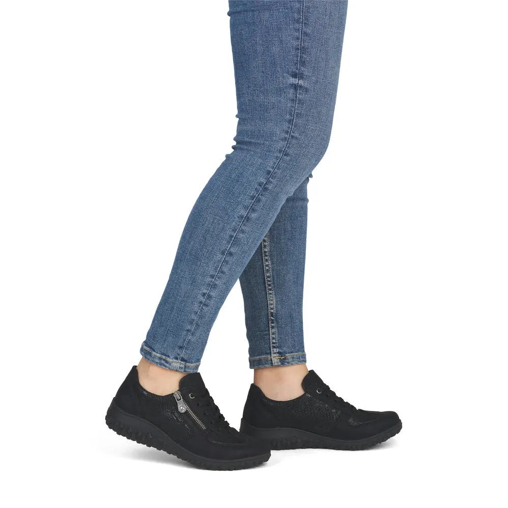 Rieker 59501-00 women's black zip & lace trainers, on-foot lifestyle view.
