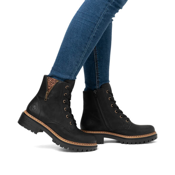 Rieker 72617-00 women's black zip & lace ankle boots, on-foot lifestyle view.