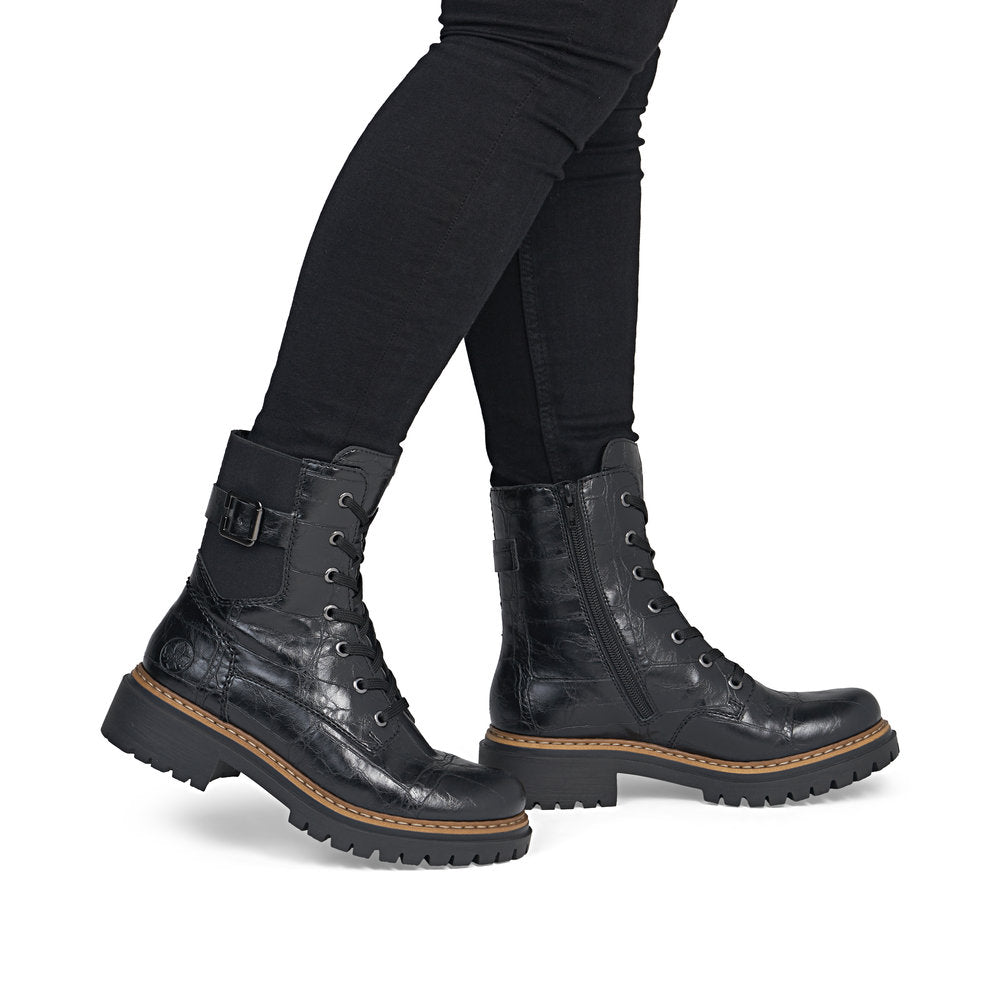 Rieker 72631-01 women's black zip & lace mid-calf boots, on-foot lifestyle view.