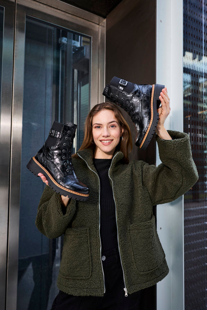 Rieker 72631-01 women's black zip & lace mid-calf boots, lifestyle view 2 of 4.