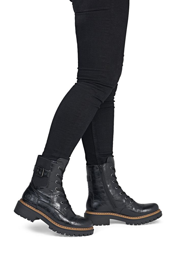 Rieker 72631-01 women's black zip & lace mid-calf boots, on-foot lifestyle view.