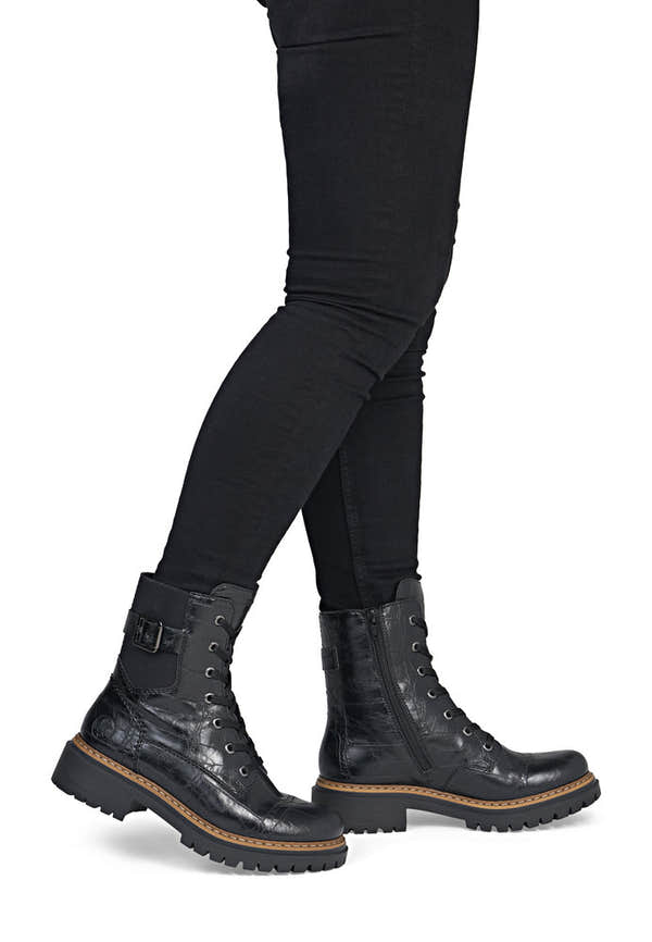 Rieker 72631-01 women's black zip & lace mid-calf boots, on-foot lifestyle view.