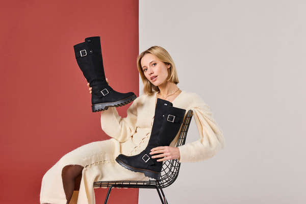 Rieker 73292-00 women's black water resistant side zip mid-calf boots, lifestyle view 6 of 17.