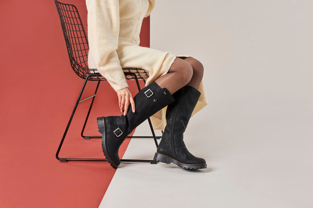 Rieker 73292-00 women's black water resistant side zip mid-calf boots, lifestyle view 8 of 17.