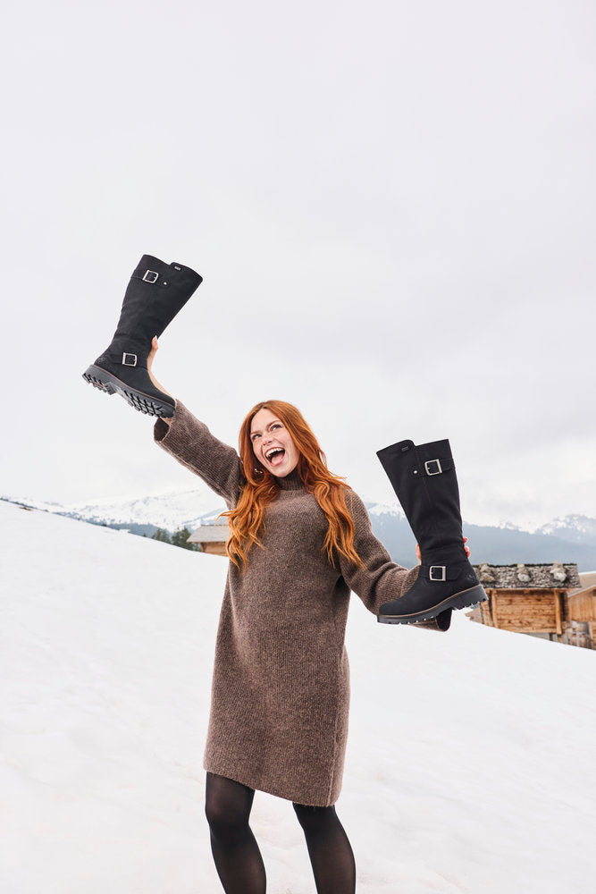 Rieker 73292-00 women's black water resistant side zip mid-calf boots, lifestyle view 11 of 17.
