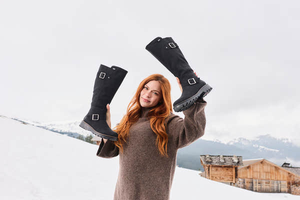 Rieker 73292-00 women's black water resistant side zip mid-calf boots, lifestyle view 12 of 17.