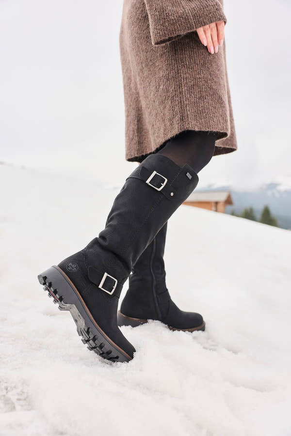 Rieker 73292-00 women's black water resistant side zip mid-calf boots, lifestyle view 14 of 17.