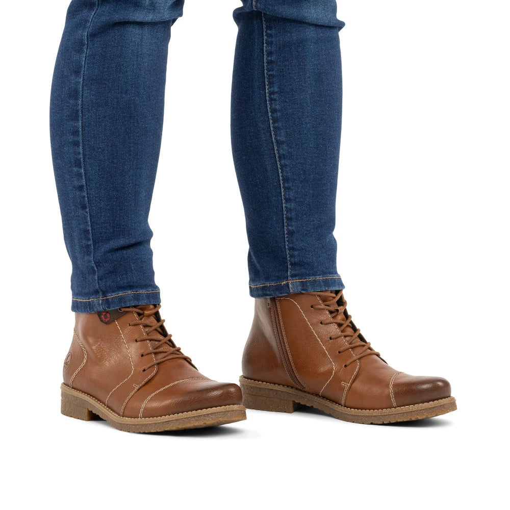 Rieker 73501-24 women's brown zip & lace ankle boots, on-foot lifestyle view.