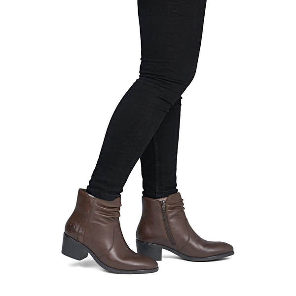 Rieker 73953-27 women's brown leather side zip ankle boots, on-foot lifestyle view.