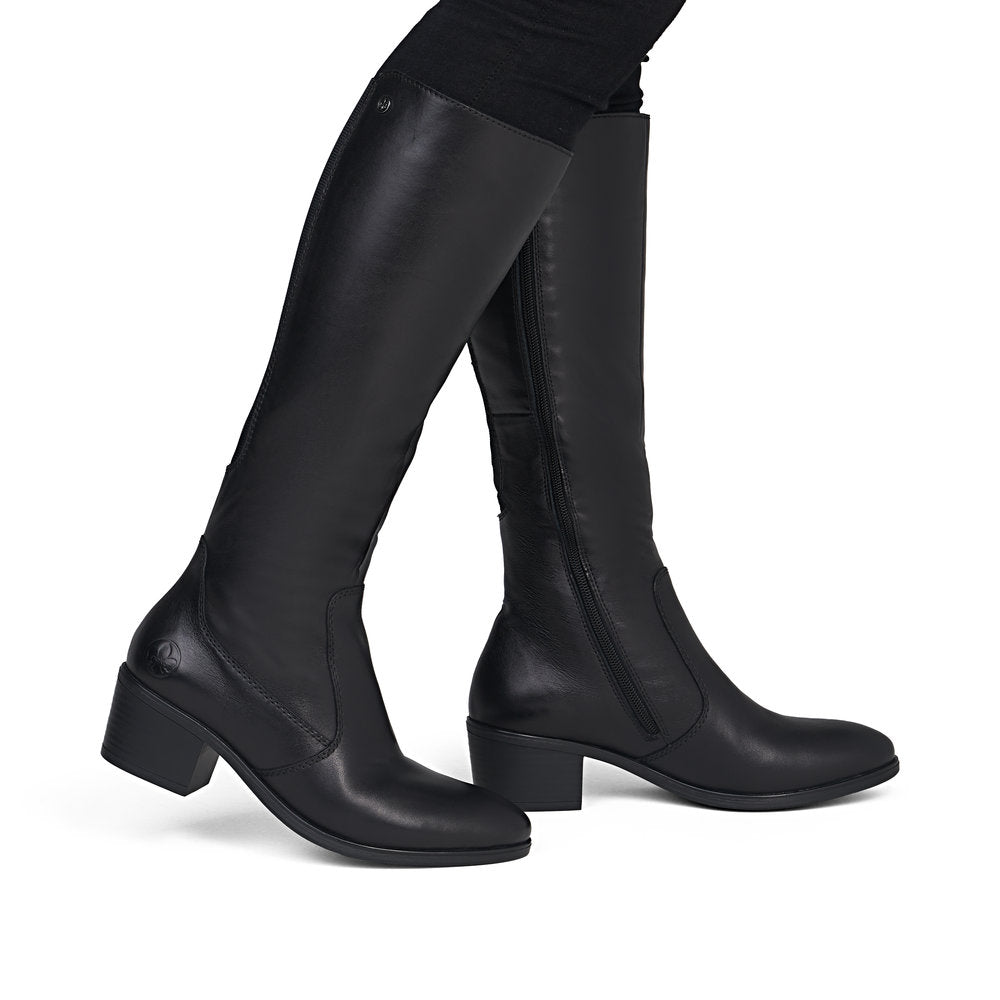 Rieker 73955-00 women's black leather side zip mid-calf boots, on-foot lifestyle view.