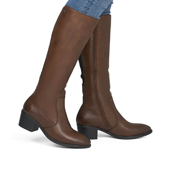 Rieker 73955-22 women's brown leather side zip mid-calf boots, on-foot lifestyle view.