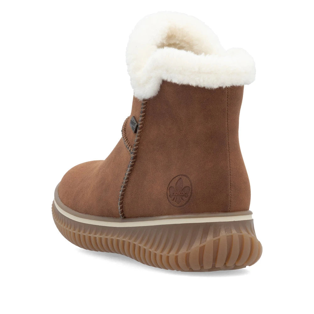 Rieker 74260-25 women's brandy water resistant slip on ankle boots, rear three-quarter view.