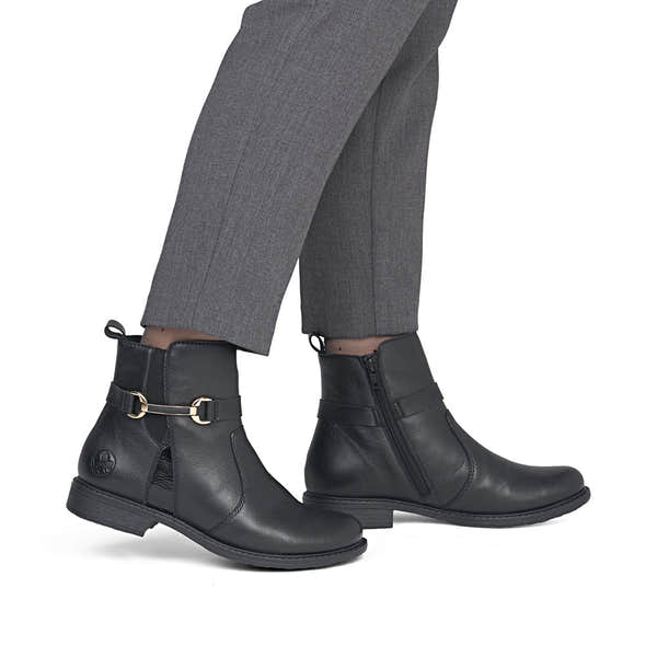Rieker 74856-00 women's wide black leather side zip ankle boots, on-foot lifestyle view.