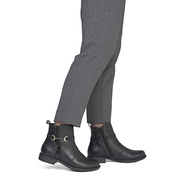 Rieker 74856-00 women's wide black leather side zip ankle boots, on-foot lifestyle view.