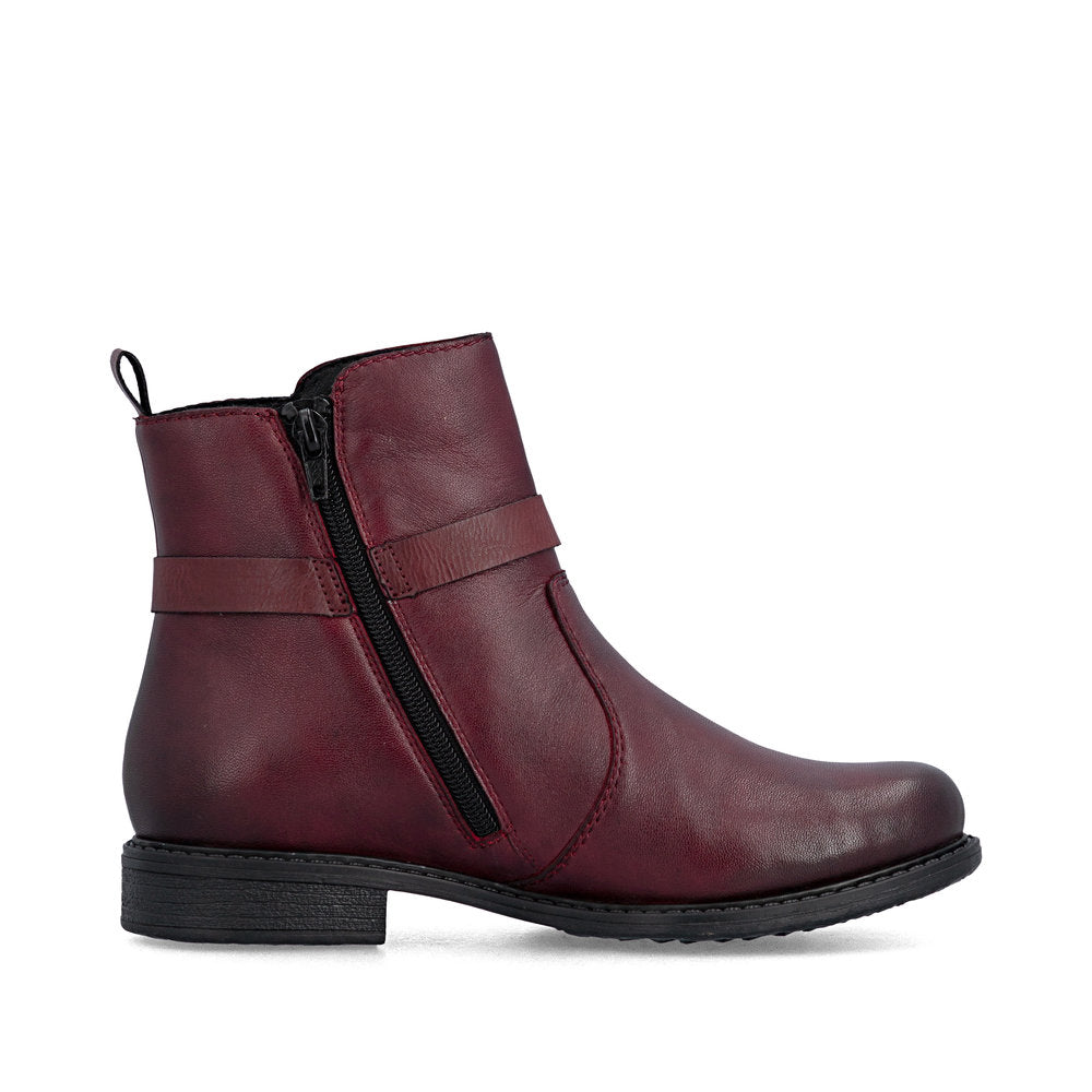 Rieker 74856-35 women's wide bordeaux leather side zip ankle boots, outer side view.