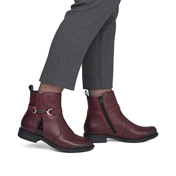 Rieker 74856-35 women's wide bordeaux leather side zip ankle boots, on-foot lifestyle view.