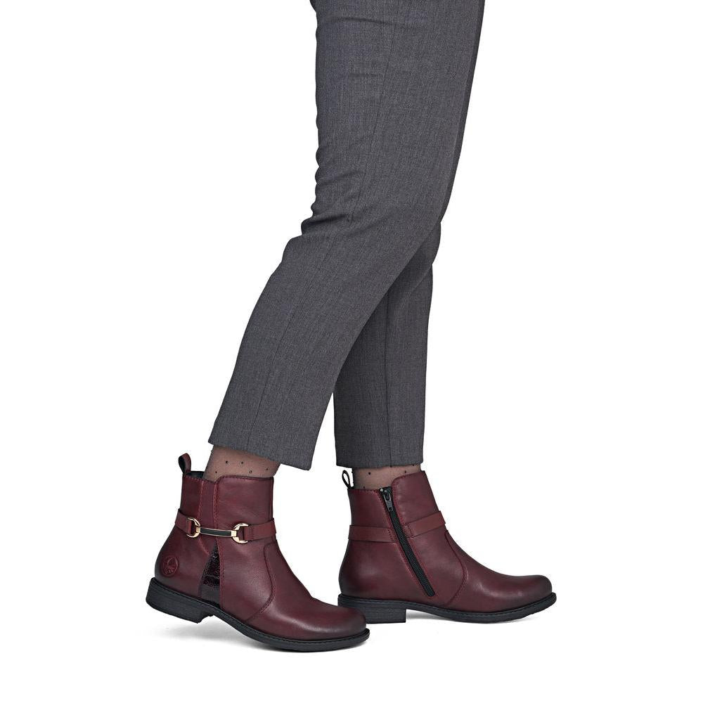 Rieker 74856-35 women's wide bordeaux leather side zip ankle boots, on-foot lifestyle view.
