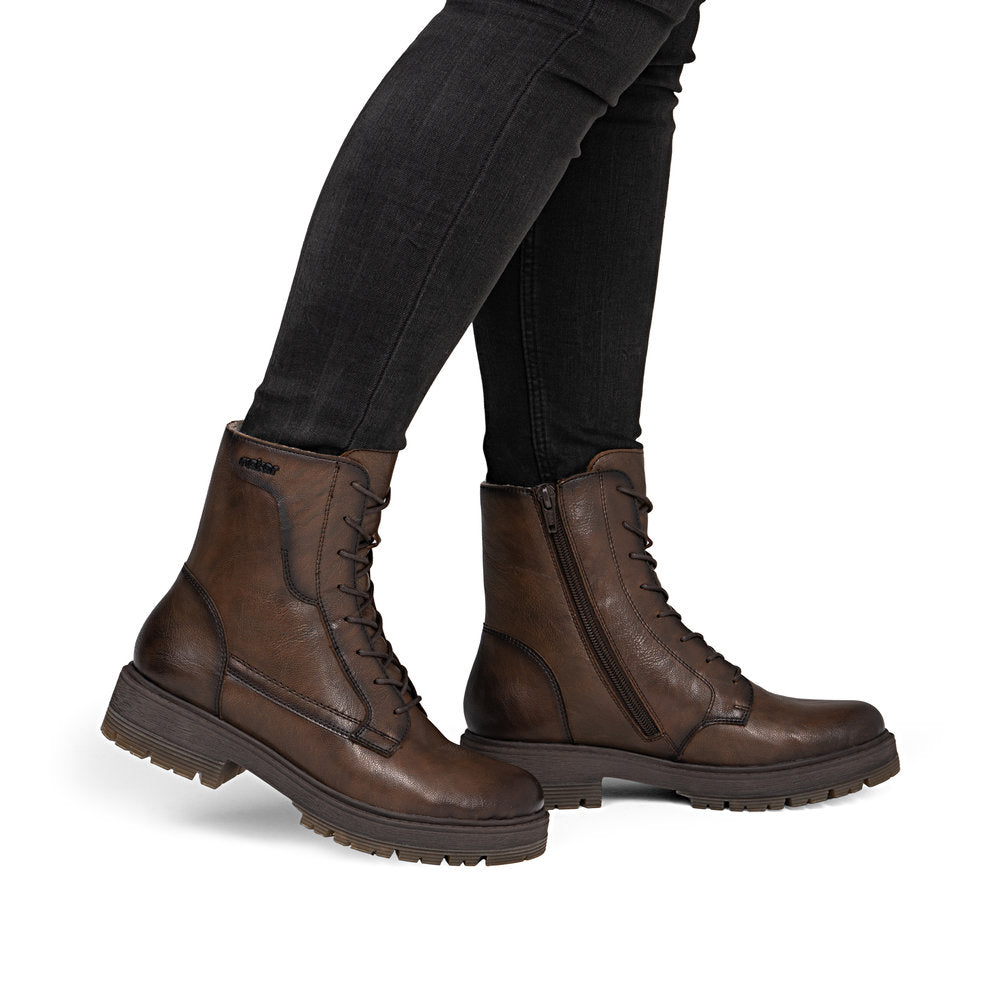Rieker 75800-25 women's wide brown leather zip & lace ankle boots, on-foot lifestyle view.