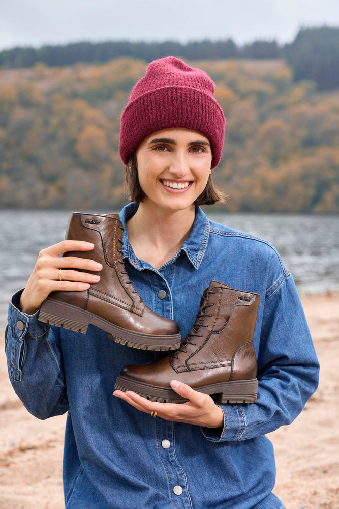 Rieker 75800-25 women's wide brown leather zip & lace ankle boots, lifestyle view 3 of 5.