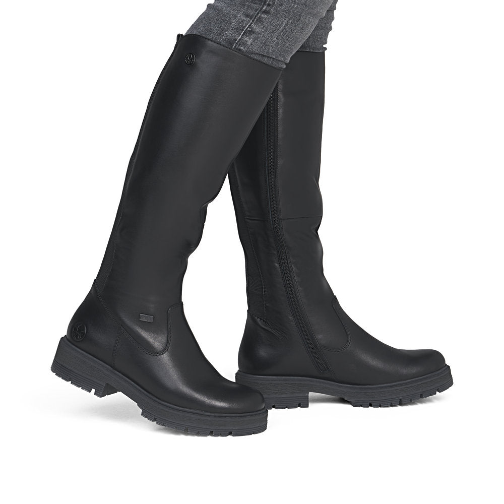 Rieker 75850-00 women's wide black leather water resistant side zip knee high boots, on-foot lifestyle view.