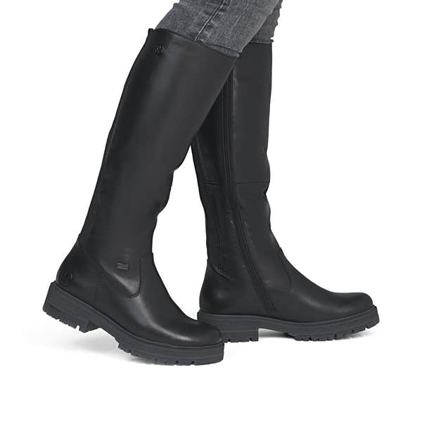 Rieker 75850-00 women's wide black leather water resistant side zip knee high boots, on-foot lifestyle view.