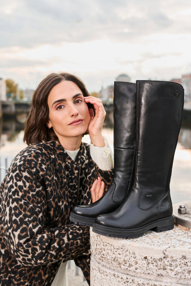 Rieker 75850-00 women's wide black leather water resistant side zip knee high boots, lifestyle view 3 of 6.