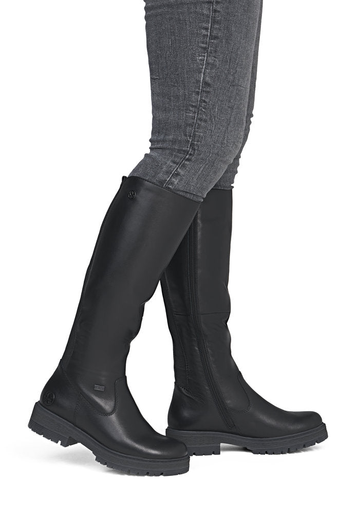 Rieker 75850-00 women's wide black leather water resistant side zip knee high boots, on-foot lifestyle view.