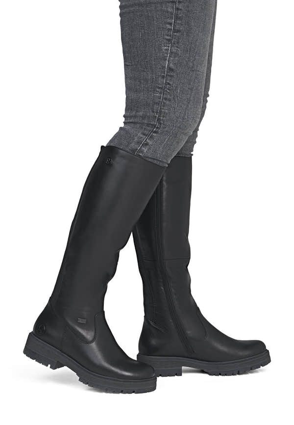 Rieker 75850-00 women's wide black leather water resistant side zip knee high boots, on-foot lifestyle view.