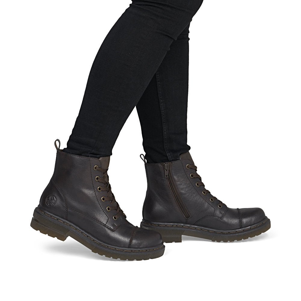 Rieker 78202-25 women's brown leather zip & lace ankle boots, on-foot lifestyle view.