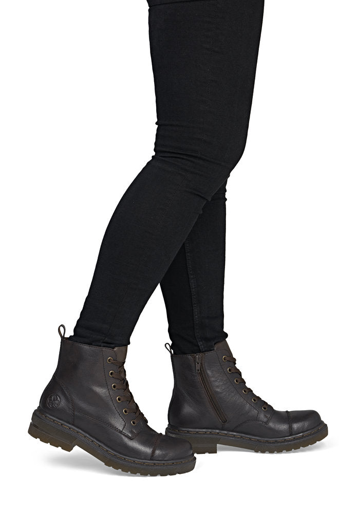 Rieker 78202-25 women's brown leather zip & lace ankle boots, on-foot lifestyle view.