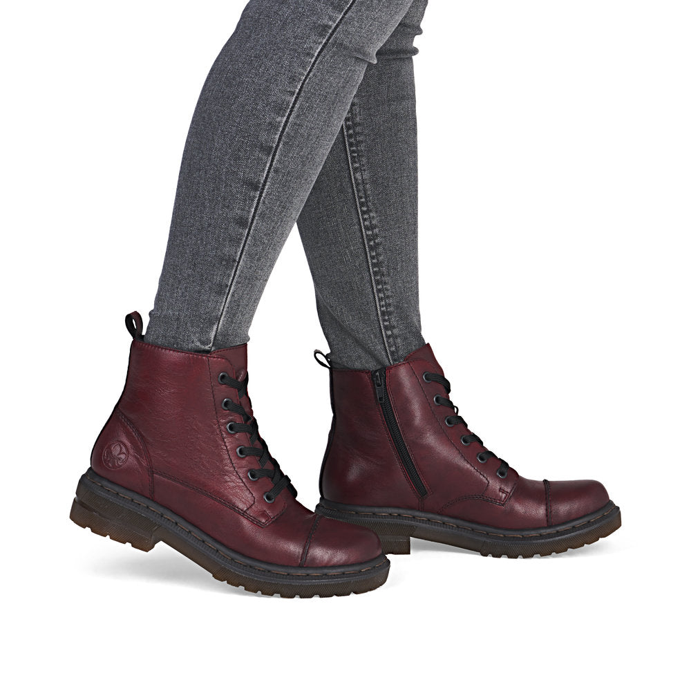 Rieker 78202-35 women's wine leather zip & lace ankle boots, on-foot lifestyle view.