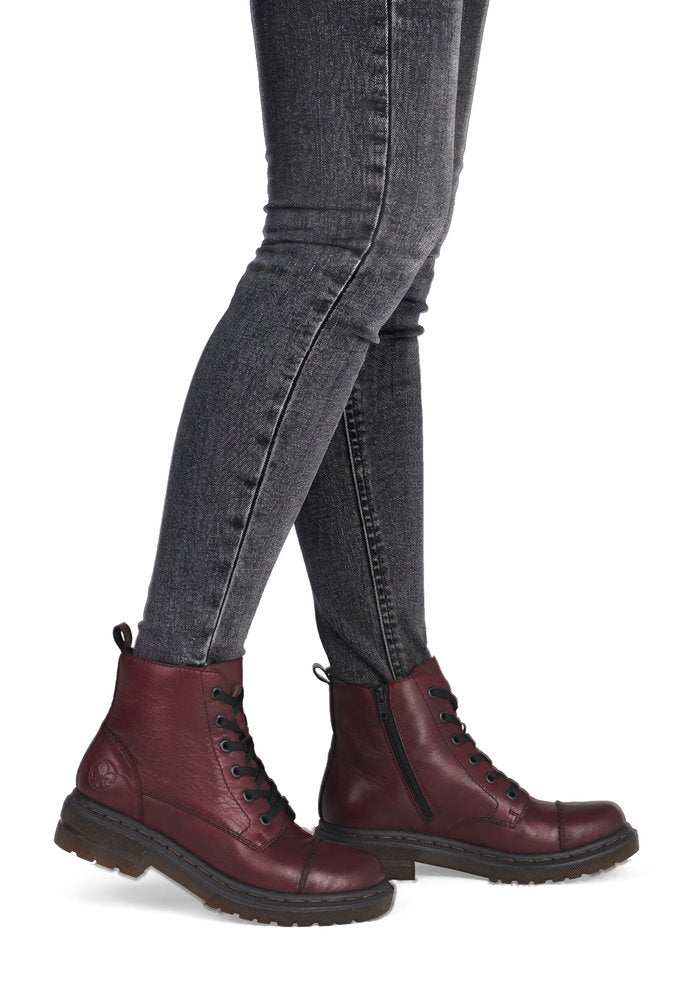 Rieker 78202-35 women's wine leather zip & lace ankle boots, on-foot lifestyle view.