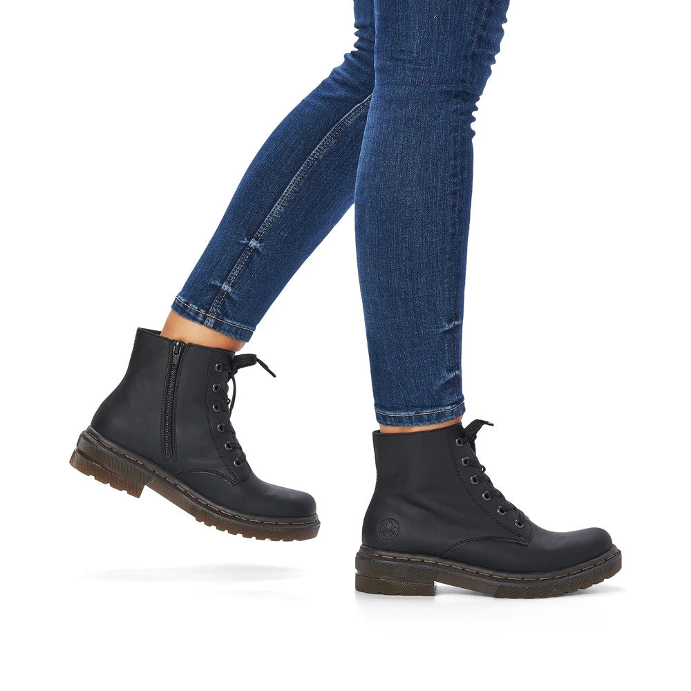 Rieker 78240-00 women's black zip & lace ankle boots, on-foot lifestyle view.