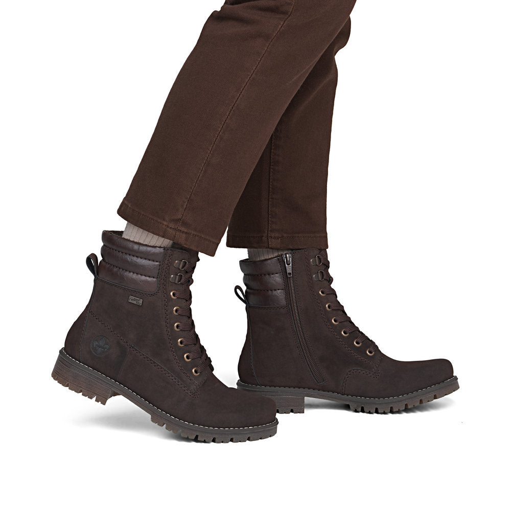 Rieker 79525-25 women's brown water resistant zip & lace ankle boots, on-foot lifestyle view.