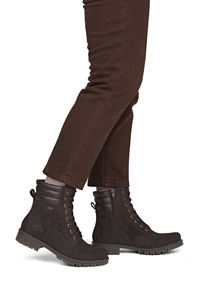 Rieker 79525-25 women's brown water resistant zip & lace ankle boots, on-foot lifestyle view.