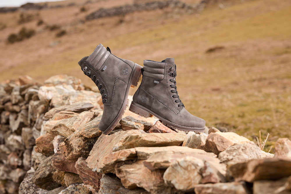 Rieker 79525-45 women's grey water resistant zip & lace ankle boots, lifestyle view 1 of 2.