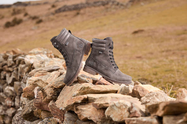 Rieker 79525-45 women's grey water resistant zip & lace ankle boots, lifestyle view 1 of 2.