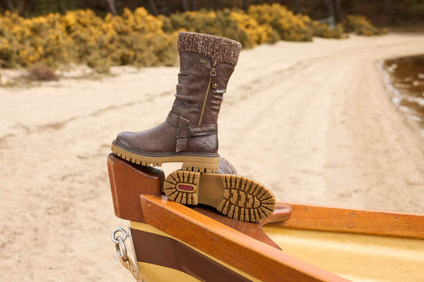 Rieker 92984-25 women's wide brown water resistant side zip mid-calf boots, lifestyle view 2 of 3.