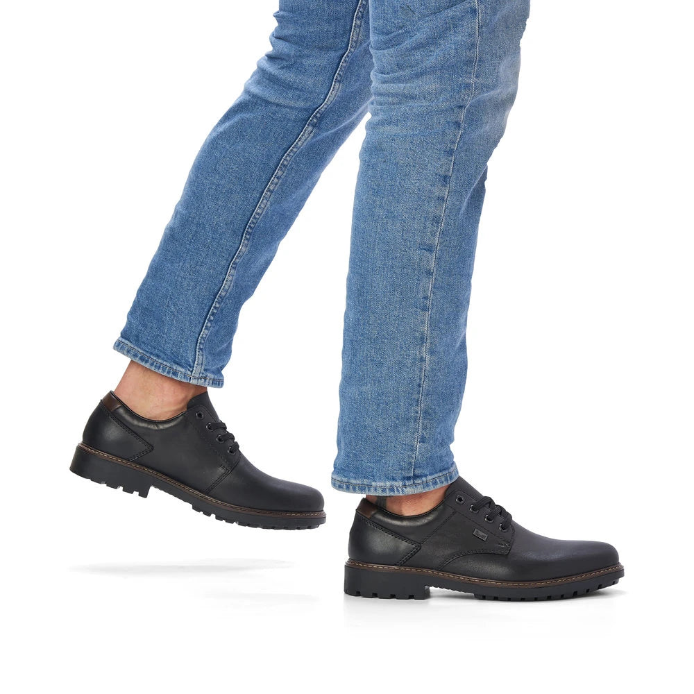 Rieker F4611-00 men's black leather water resistant lace up shoes, on-foot lifestyle view.