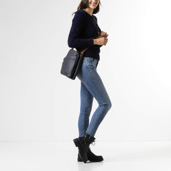 Rieker H1005-14 women's navy handbag with cross over tan strap, front view.