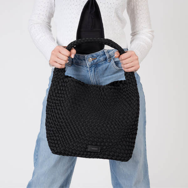 Rieker H1044-00 Black Woven Handbag with Matching Pouch, lifestyle view 11 of 14.