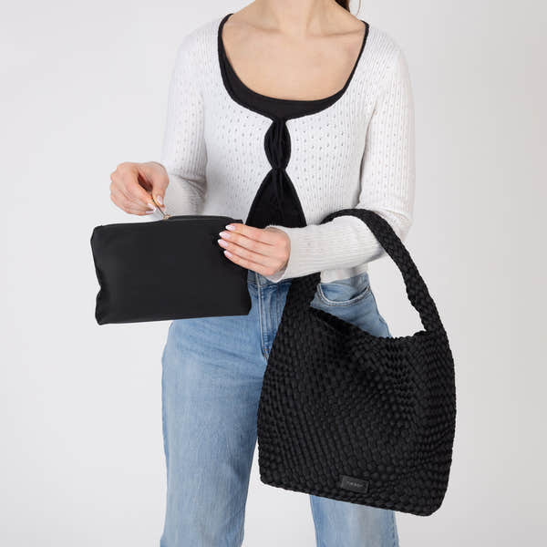 Rieker H1044-00 Black Woven Handbag with Matching Pouch, lifestyle view 13 of 14.