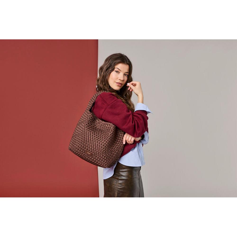 Rieker H1044-25 Brown Woven Handbag with Matching Pouch, lifestyle view 1 of 8.