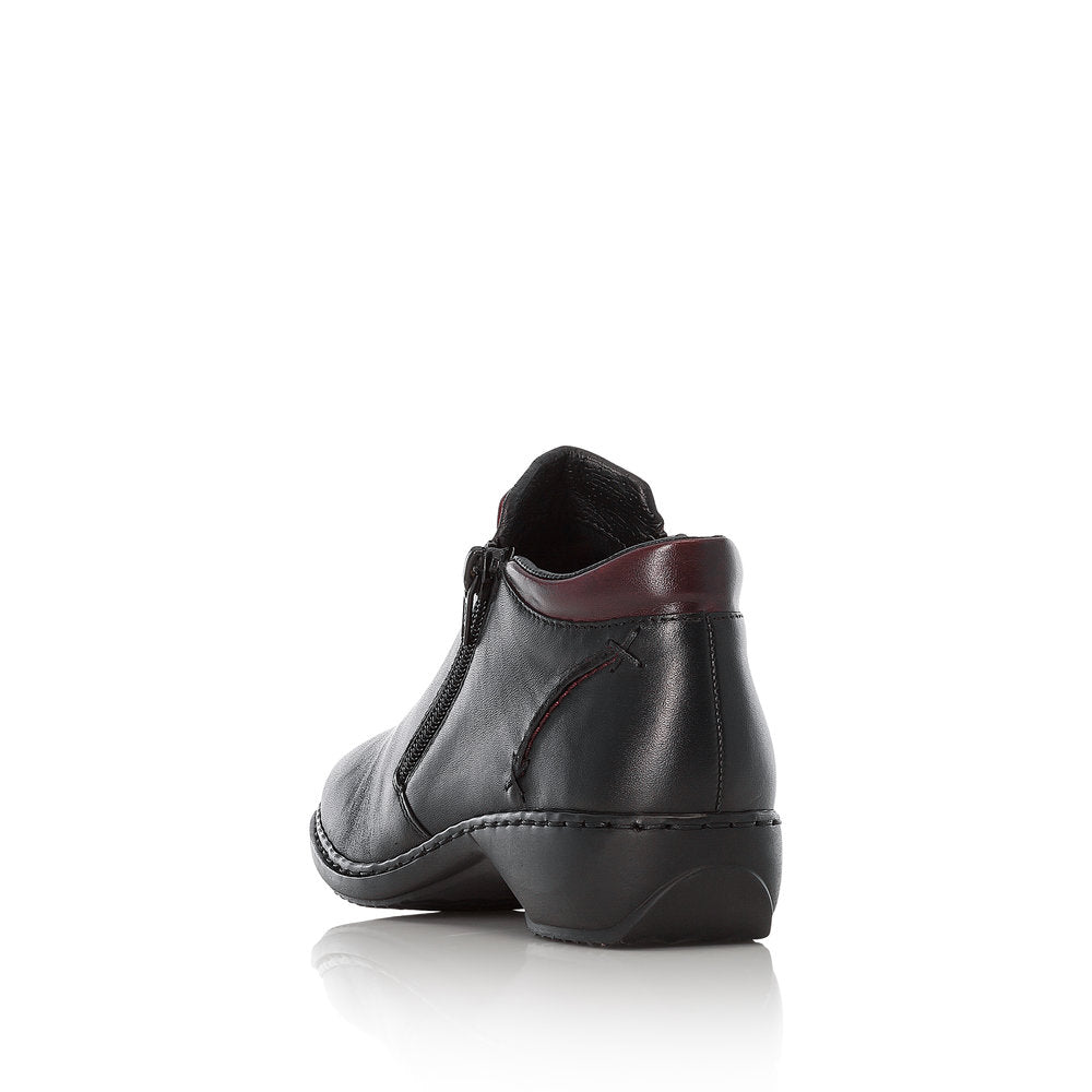 Rieker L3882-00 women's black leather zip up ankle boots, rear three-quarter view.