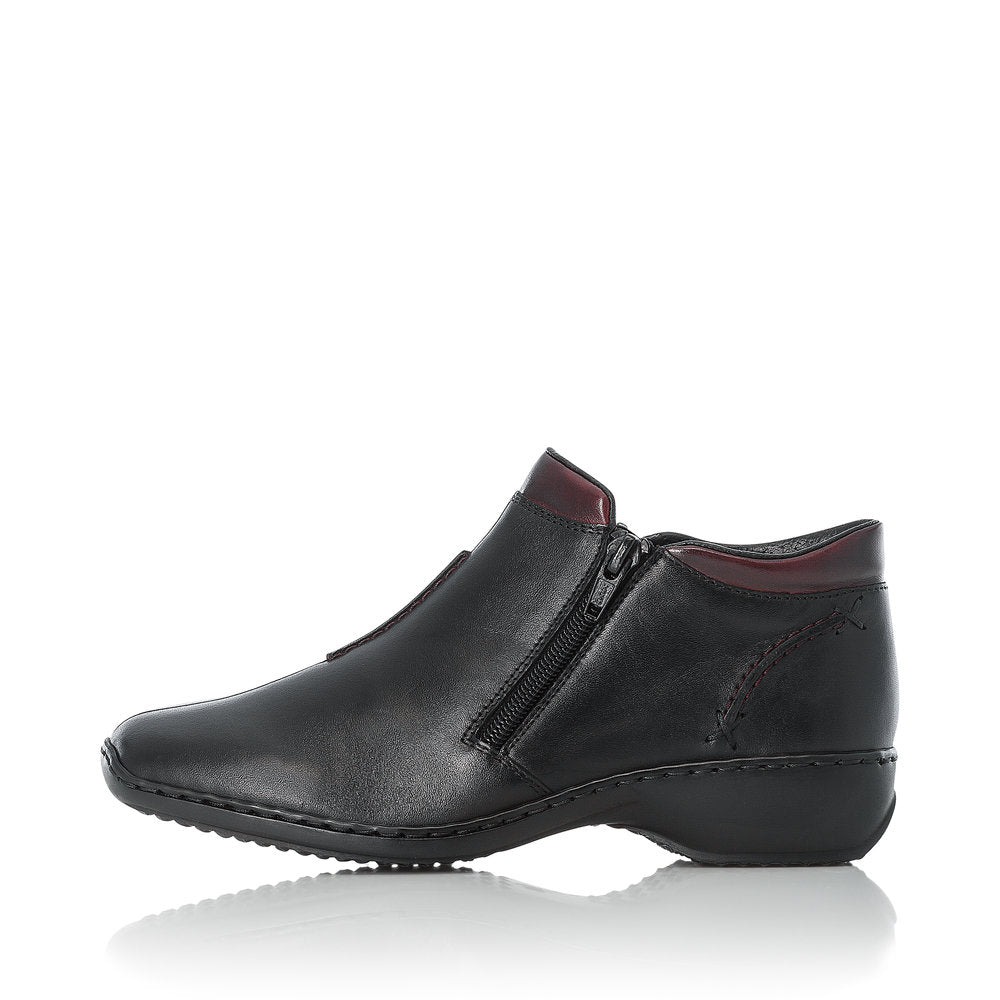 Rieker L3882-00 women's black leather zip up ankle boots, inner side view.