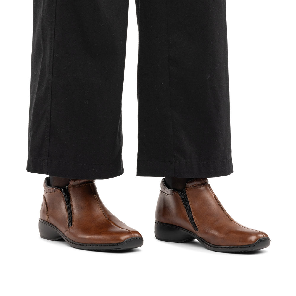 Rieker L3882-24 women's brown leather twin zip ankle boots, on-foot lifestyle view.